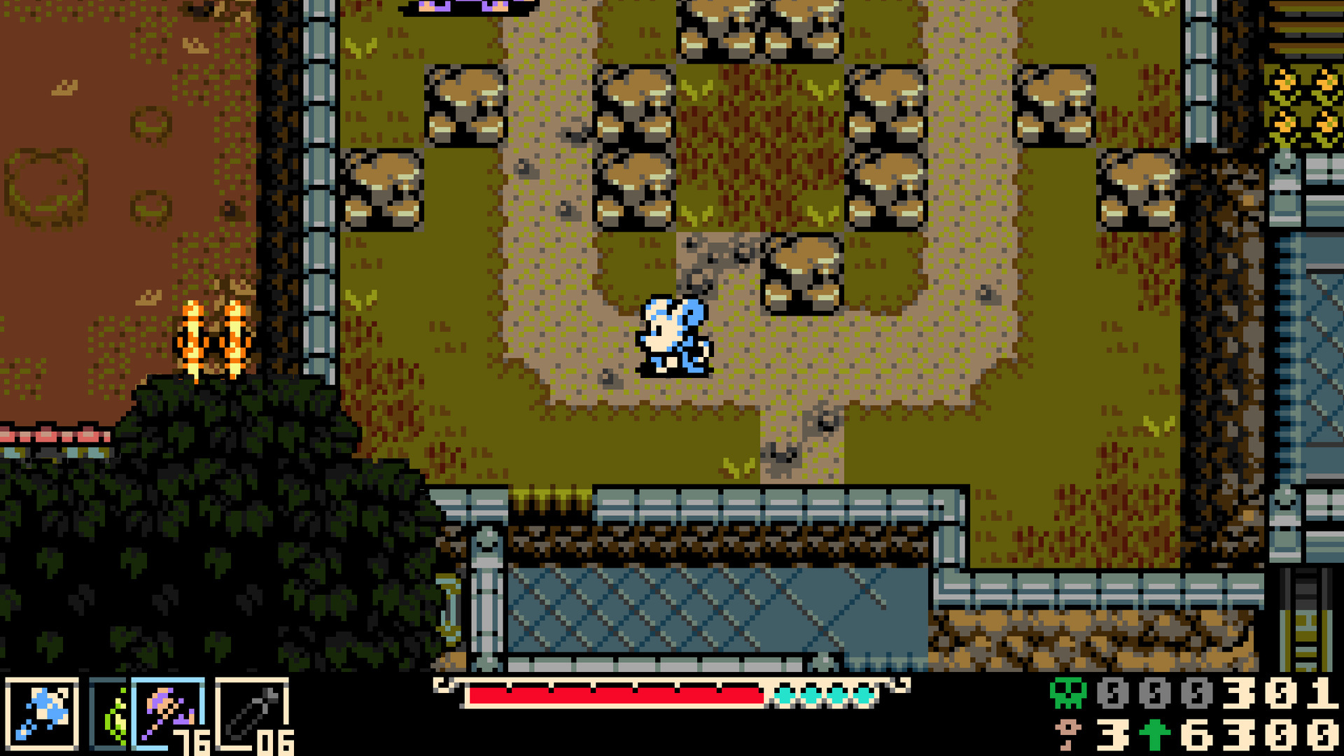 Top-down outdoor traversal, Mina in a grassy field threaded with boulders and fencing