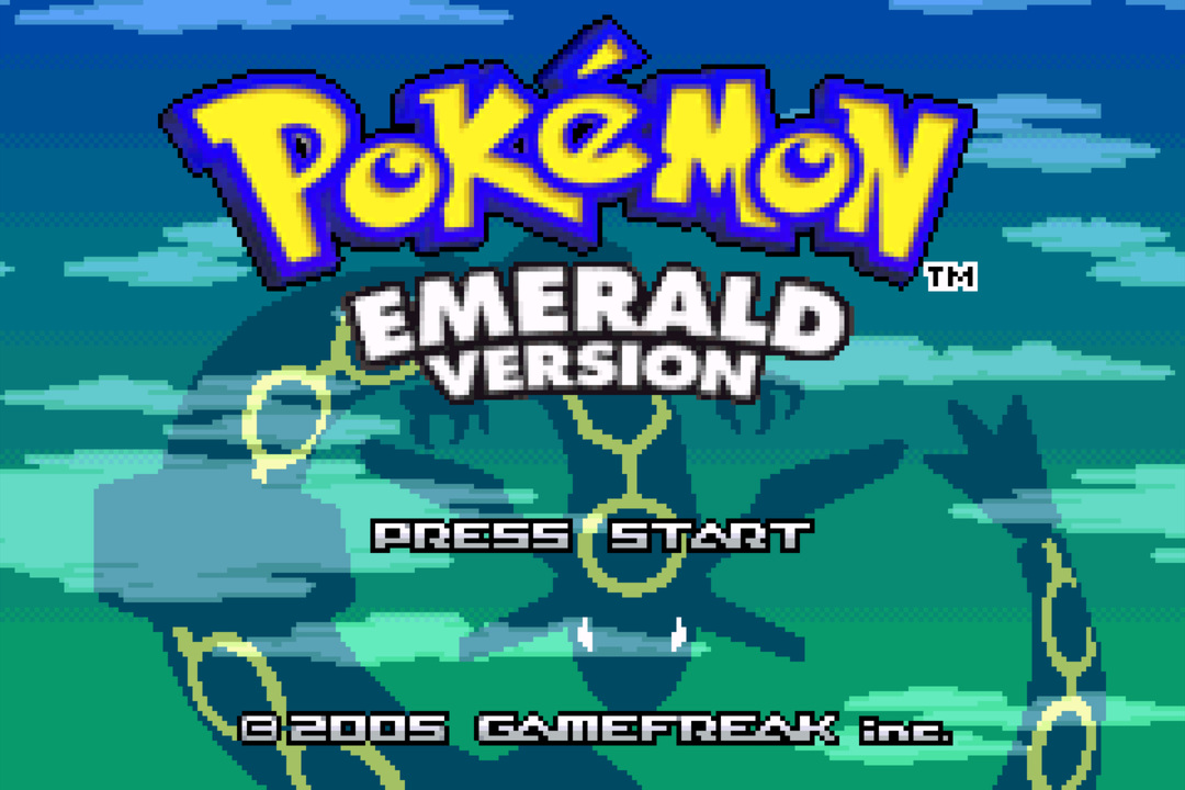 Pokémon Emerald title screen — yellow Pokémon logo over a green-blue ocean-cloud background, "Emerald Version" subtitle, Press Start prompt, © 2005 GAMEFREAK inc., a faint Rayquaza silhouette behind the logo