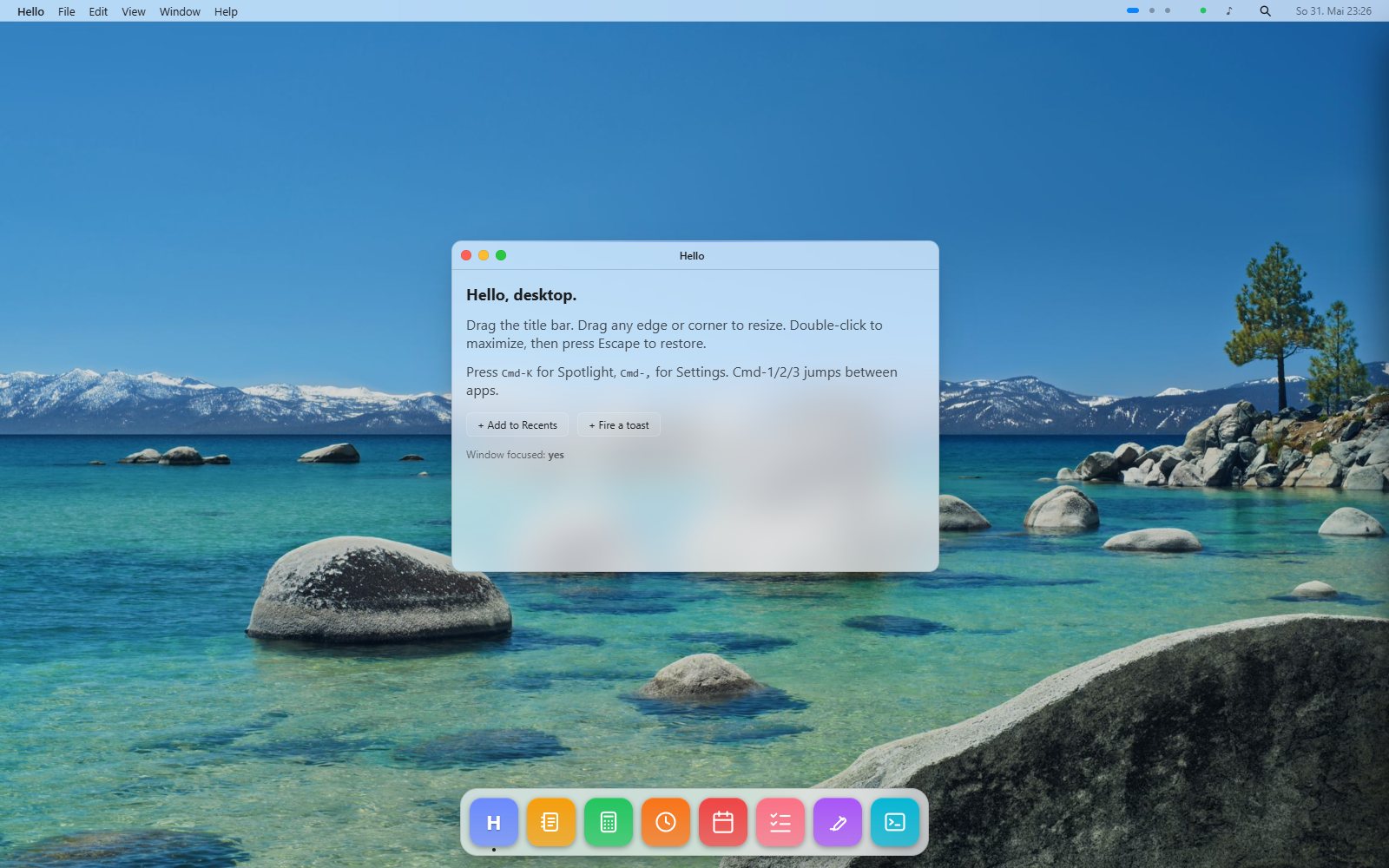 The macOS theme: a window with red, yellow, and green traffic-light controls and a floating dock over the macOS Tahoe wallpaper